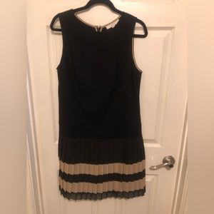 Cute black sheath dress with pleated skirting